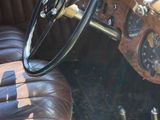 a brown leather seat in the back of a car