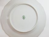a white plate with a green design on it