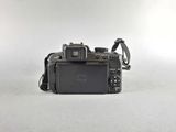a camera that is sitting on a white surface