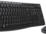 keyboard and mouse on a white surface with a white background