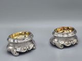 pair of silverplated candlesticks with ornate design