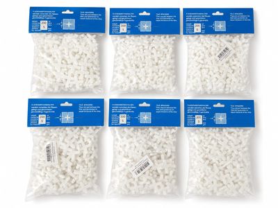 four bags of white plastic beads on a white background