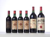 six bottles of wine are lined up on a table