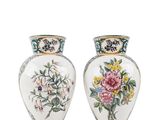 pair of vases with floral designs on them on a white background