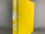 a close up of a yellow binder with a white logo on it