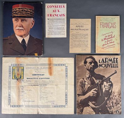 some old military memorabilias are on display on a table