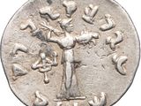 a silver coin with an image of a woman holding a child