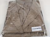four pieces of cloth wrapped in plastic bags on a table