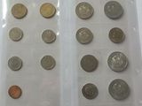 a lot of coins in a plastic bag on a table