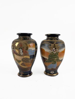 two vases sitting side by side on a white surface