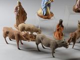 many figurines of people and animals in a circle