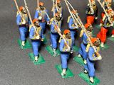 many figurines of men dressed in blue uniforms
