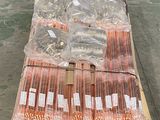a pallet full of many different kinds of straws on a pallet