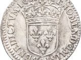 an old silver coin with a crown on top of it
