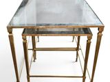two tables with a glass top and gold legs