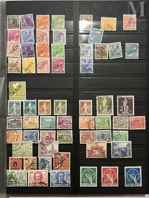 an assortment of stamps and stamps on display in a display case