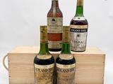 trois bouteilles de vin ancien et rare dans un coffret en bois