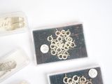 many different types of jewelry in the box