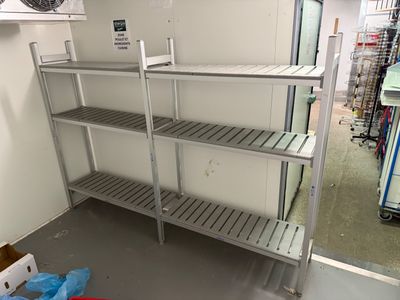 a metal shelving in the middle of a room