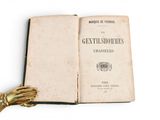 a book with a gold glove on top of it