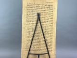 a wooden plaque with a hammer on top of it