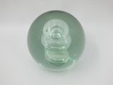 a glass object that is sitting on a white surface