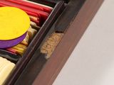 a wooden box filled with different types of matches