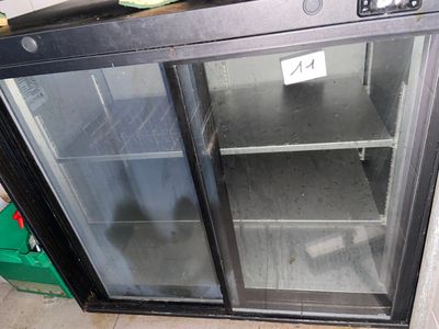 an image of a glass door with a sign on it