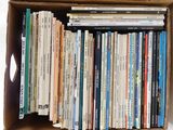 a box full of books that are sitting on top of a table
