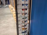a rack with many glasses on it in a store