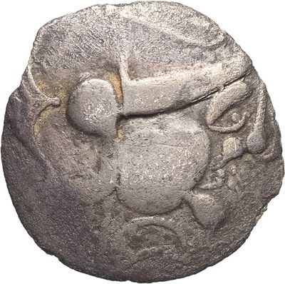 an image of a silver coin with a face on it