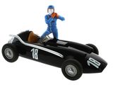 a figurine of a man riding in a race car