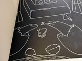 a black and white picture of a drawing on a book