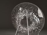 an image of a broken glass object on a table