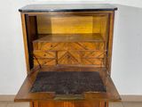 a wooden cabinet with a marble top and drawers