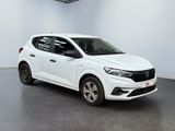 a white car in a white room with a black floor