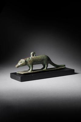 an egyptian bronze figurine of a rat
