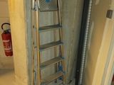 a ladder leaning against a wall in a room
