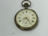 an old pocket watch with roman numerals on it