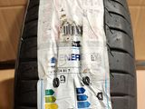 a close up of a tire on a cardboard box on a floor