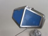 a small television on a stand with a blue screen