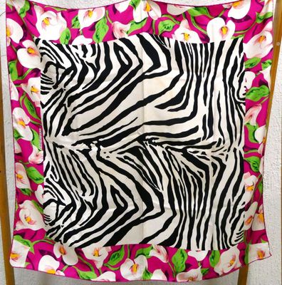 a chair with a zebra print blanket on it