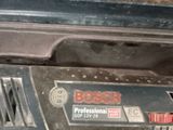 a bosch power tool that is sitting on the floor
