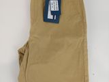 a close up of a pair of tan pants on a white surface