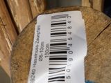 a barcode on a piece of wood that is sitting on top of it