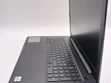 a laptop computer sitting on top of a white table