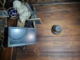 a small television sitting on top of a wooden table