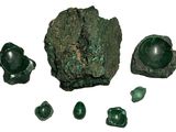 some green rocks and green stones on a white surface