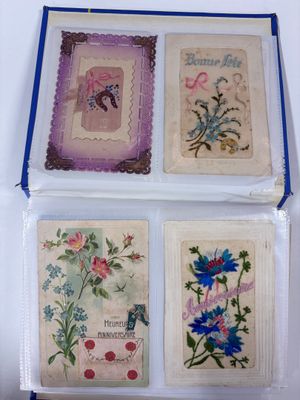 four greeting cards in a clear box with blue trimmings