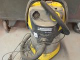 a vacuum that is sitting on the floor in the room
